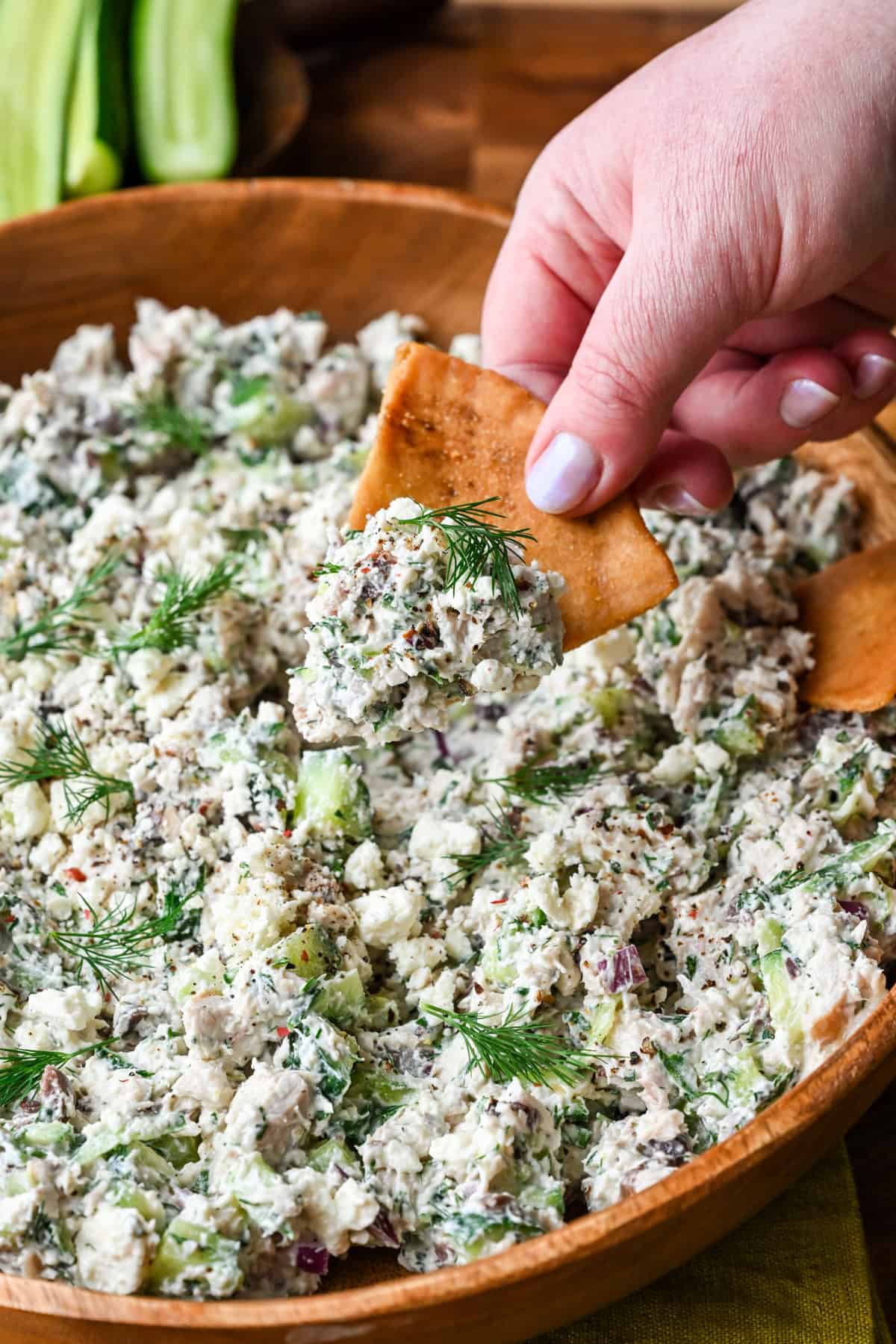 Tzatziki chicken salad scooped on a pita chip.