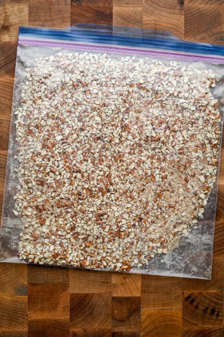 Overhead view of crushed pretzels in a bag.