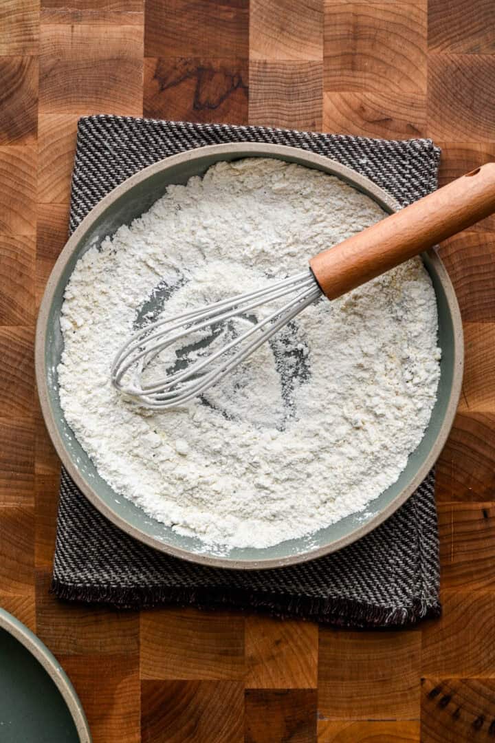 Overhead view of flour in a bowl.