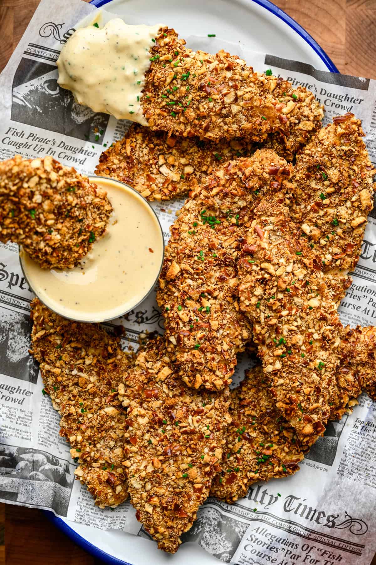 Overhead view of chicken tenders on a plate.