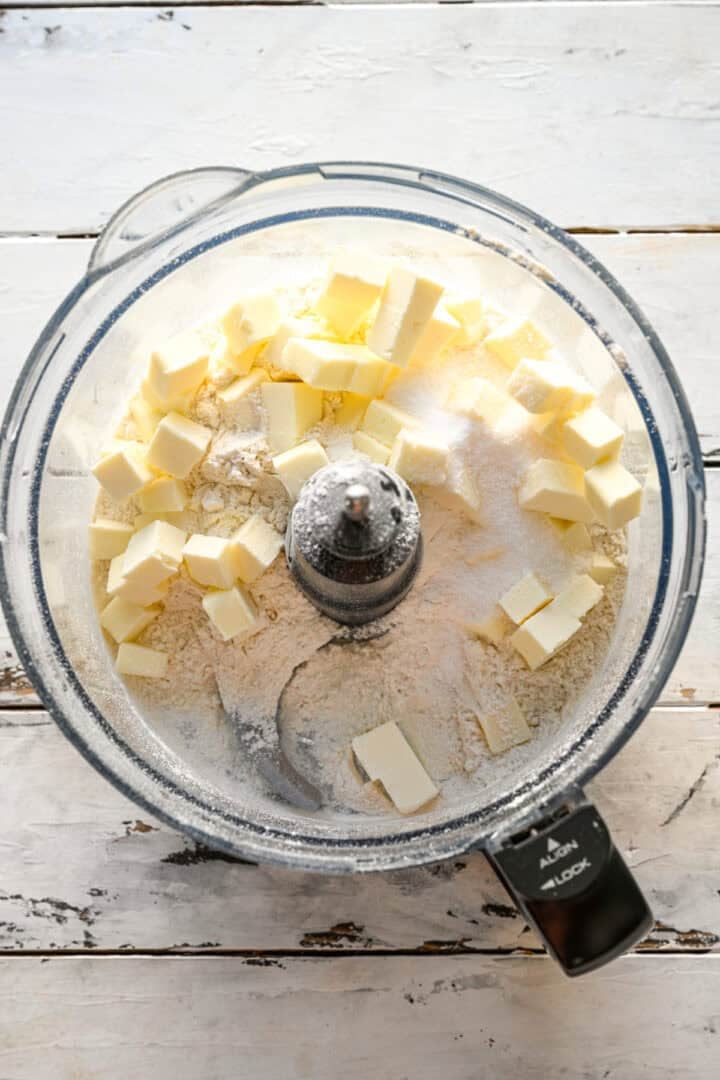 overhead view of pop tart dough ingredients in food processor before mixing together.