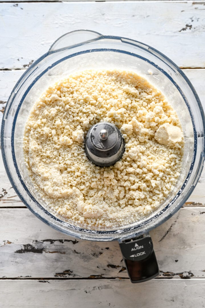 overhead view of pop tart dough ingredients in food processor after mixing together.