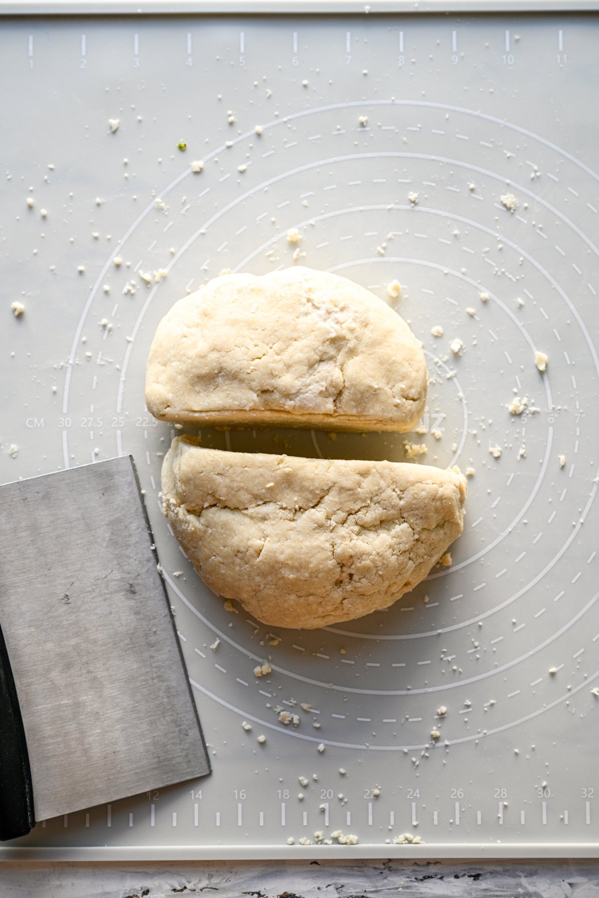 overhead view of pop tart dough divided in half on baking sheet. 