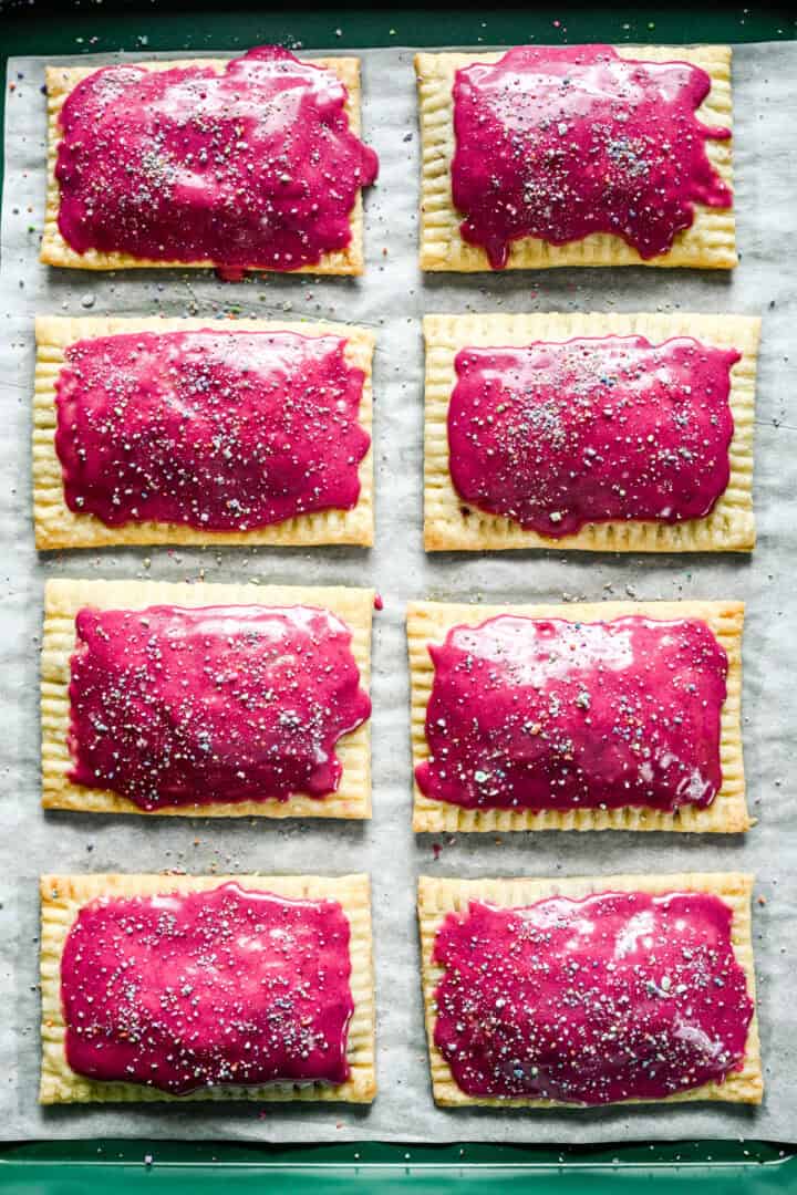 Overhead view of blueberry pop tarts topped with purple icing.