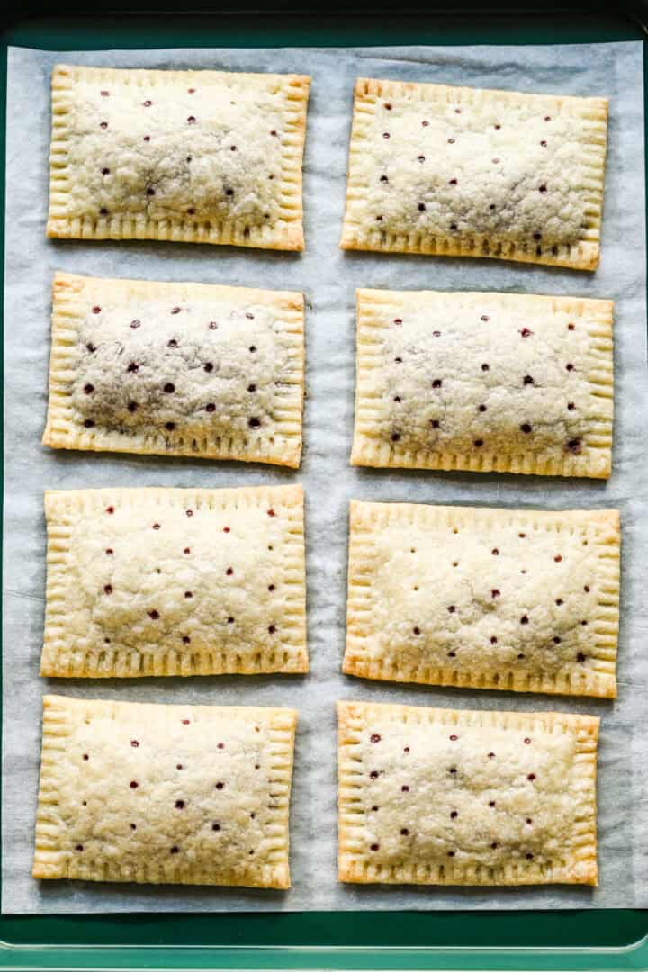 8 pop tarts on a sheet pan after baking. 