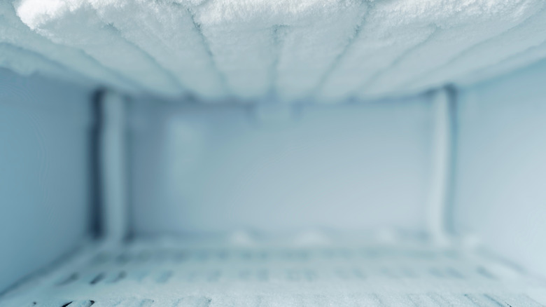 Empty freezer with ice buildup.