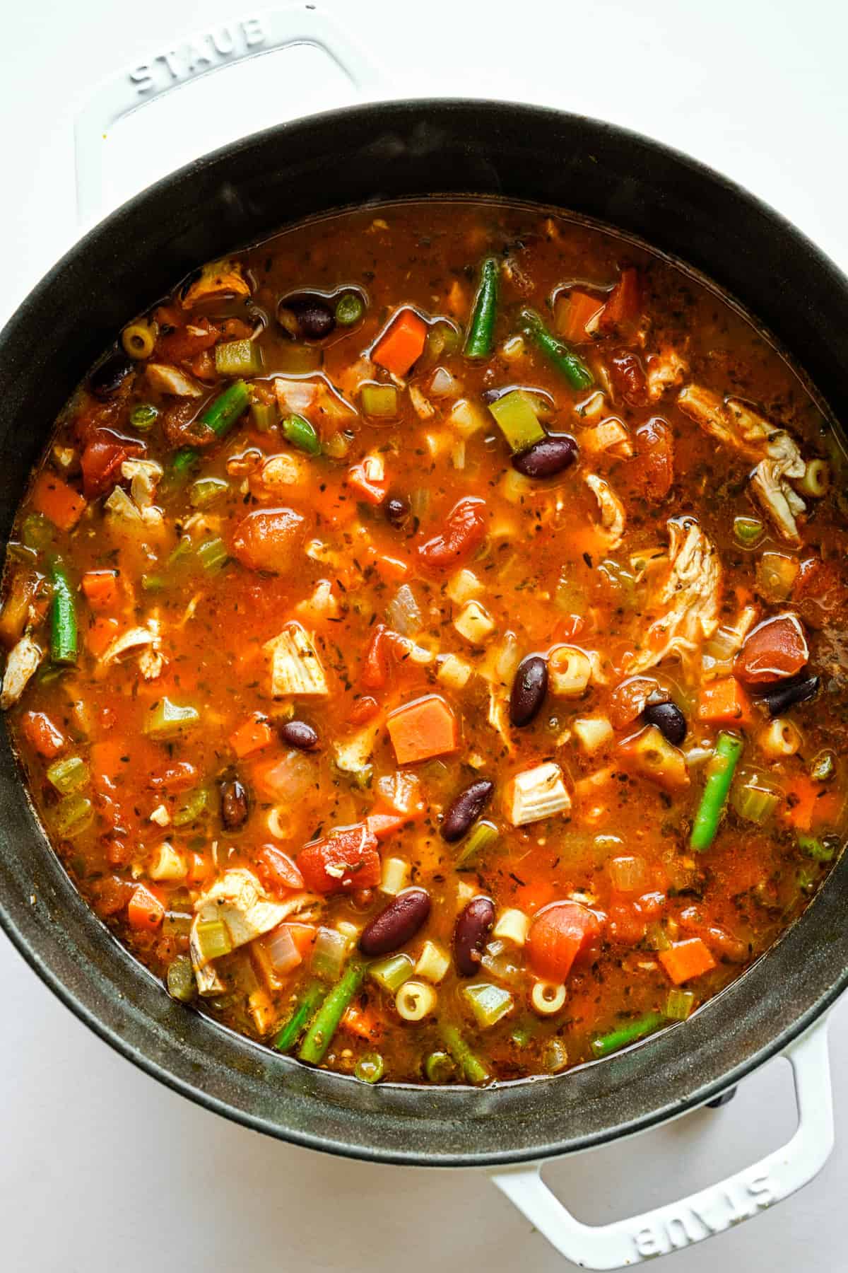 Pasta, green beans, and chicken simmered in the pot with the rest of the ingredients.