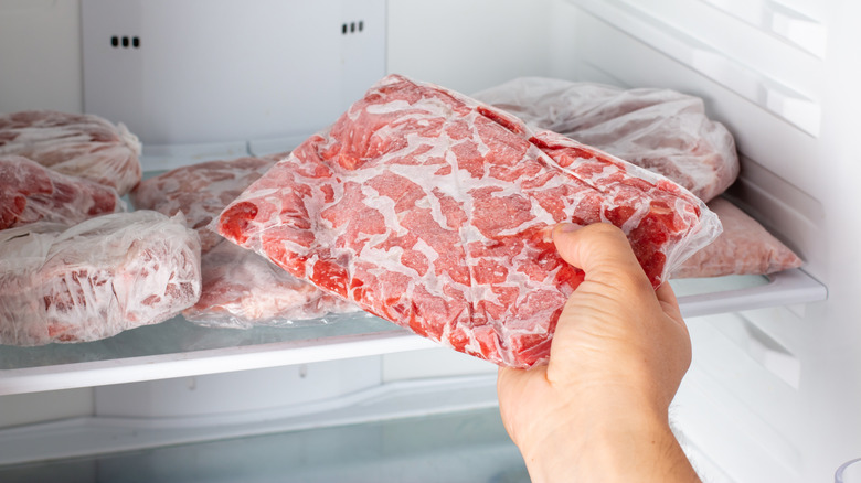 placing individual portions of meat in the freezer