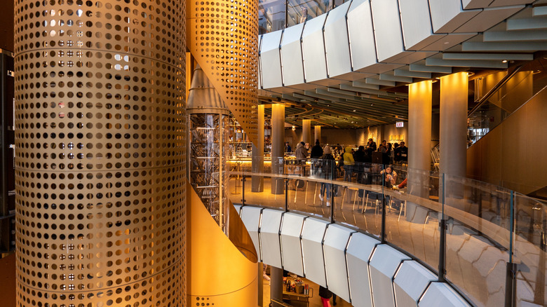 Side view of the impressive 56-foot cask that takes roasted beans from the first floor to the top of Chicago's Starbucks Reserve Roastery