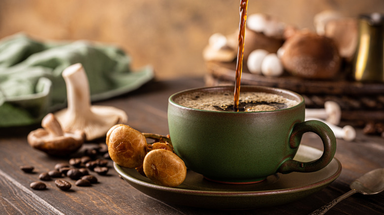 Mushrooms on a saucer with a coffee cup that's being filled with coffee