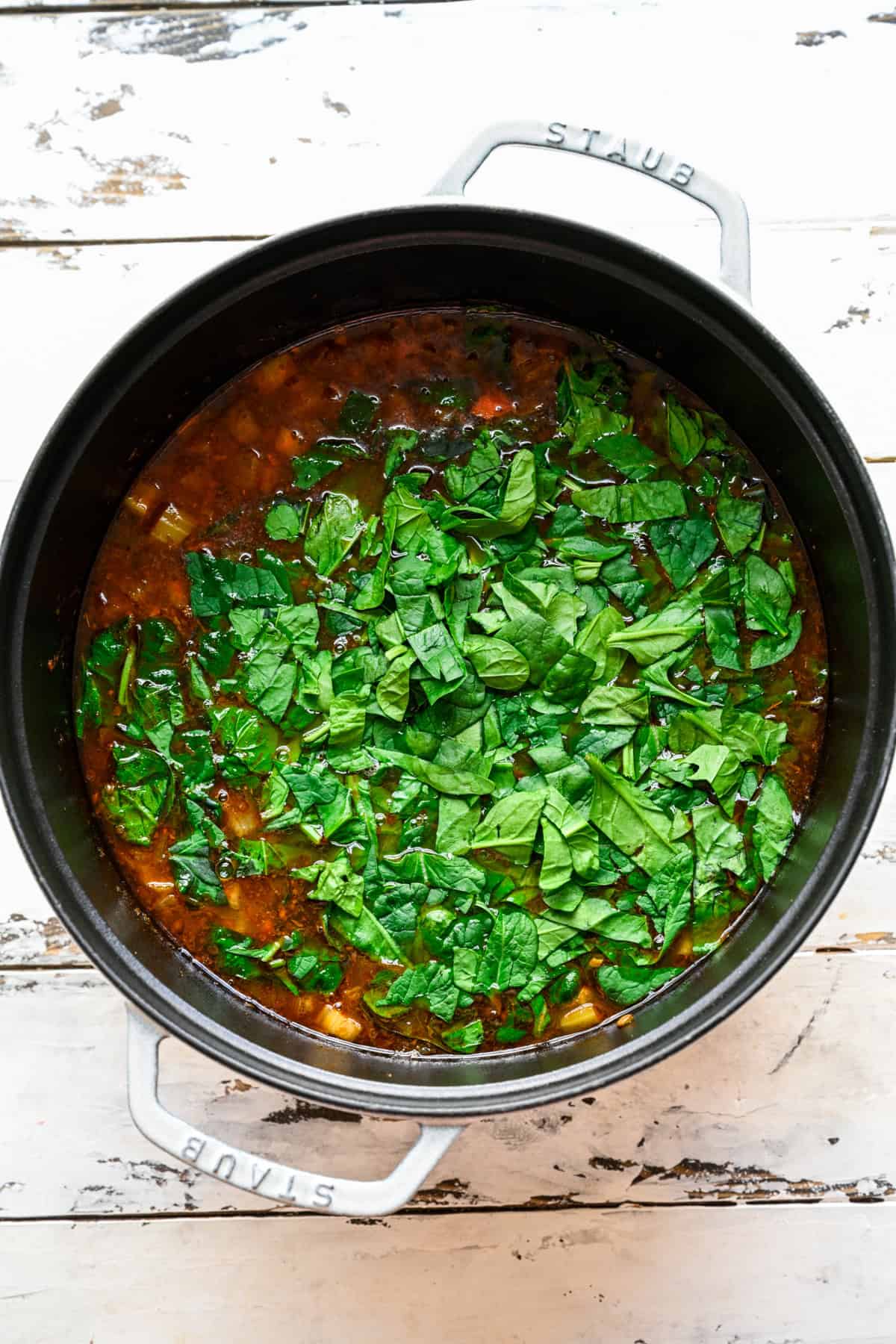 Spinach and parsley added to the pot.