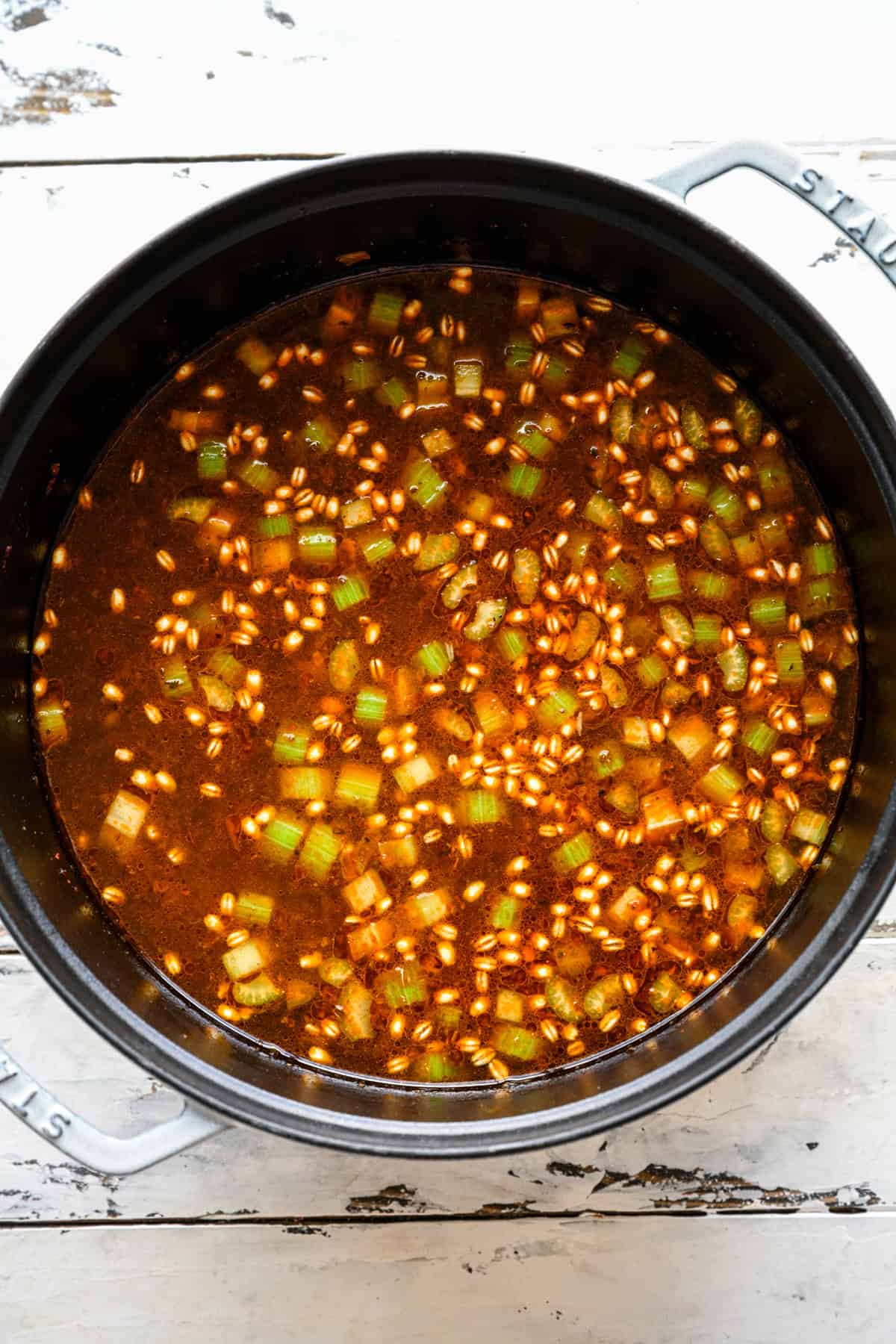 Broth added to the veggies in the pot.