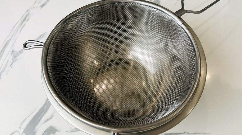 Sieve set over bowl