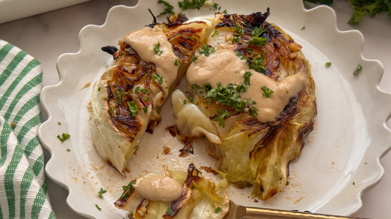 cabbage steak on plate with tahini sauce