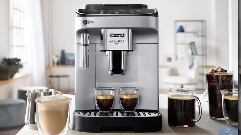espresso machine with espresso drinks surrounding it