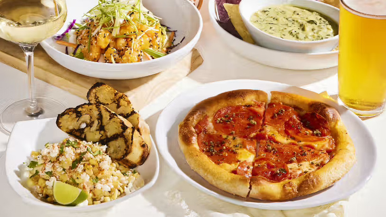 Four dishes and drinks from CPK on a white background