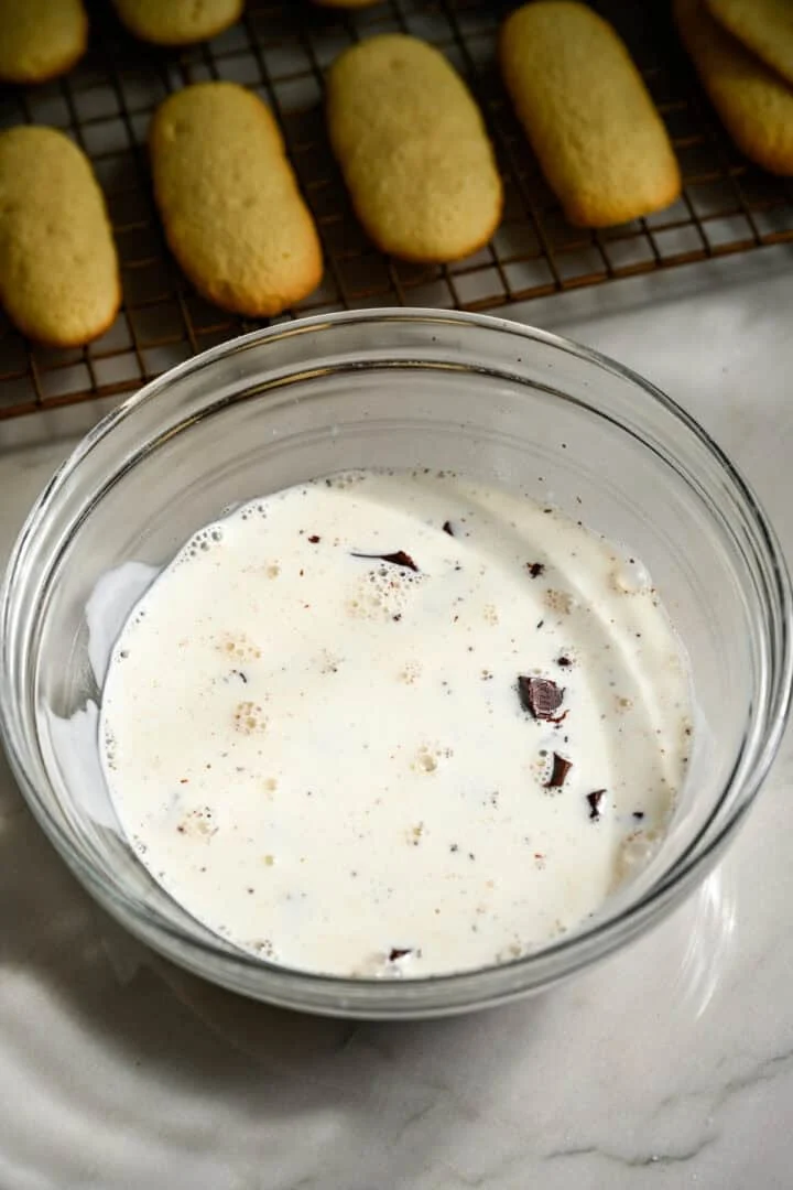 chocolate and heavy cream in a mixing bowl.