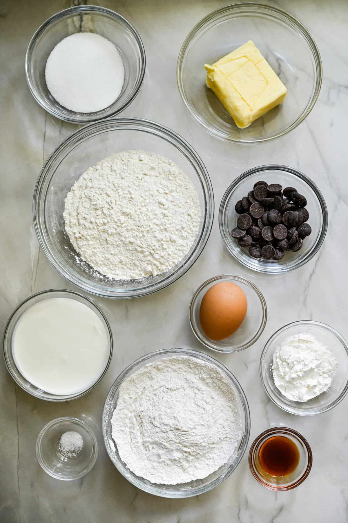 overhead view of ingredients for homemade milanos in separate small glass bowls.
