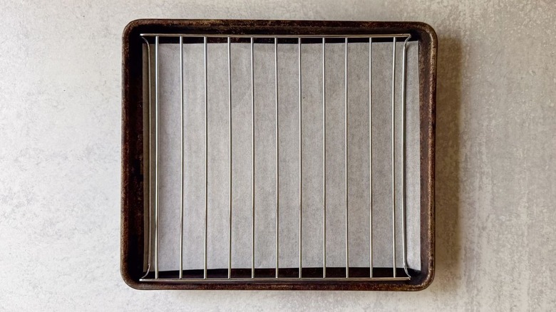 Small baking sheet lined with parchment paper and fitted with a rack