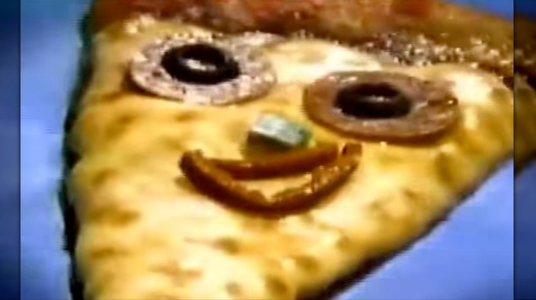 Still of Pizza head floating in pool