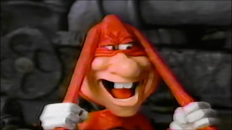The Noid pulling his bunny-like ears in fiendish delight