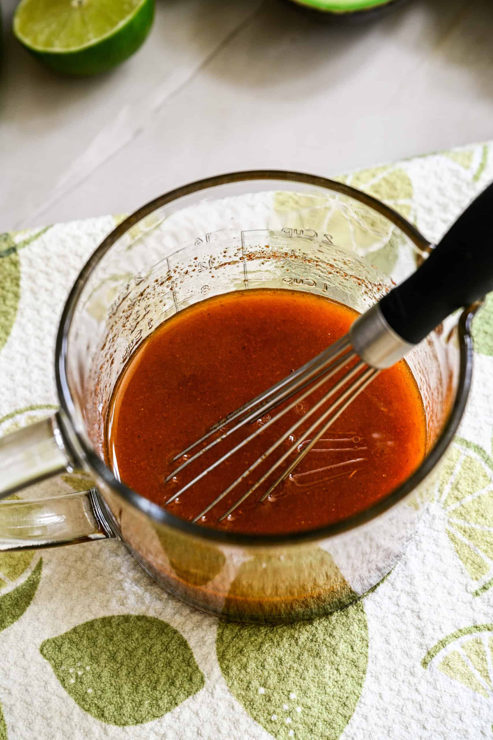 cowboy caviar salad dressing whisked together in a jar.