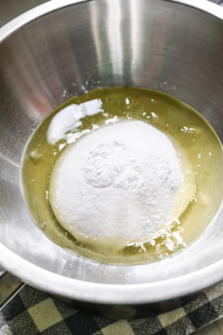 egg white, sugar and cream of tartar over a double boiler.