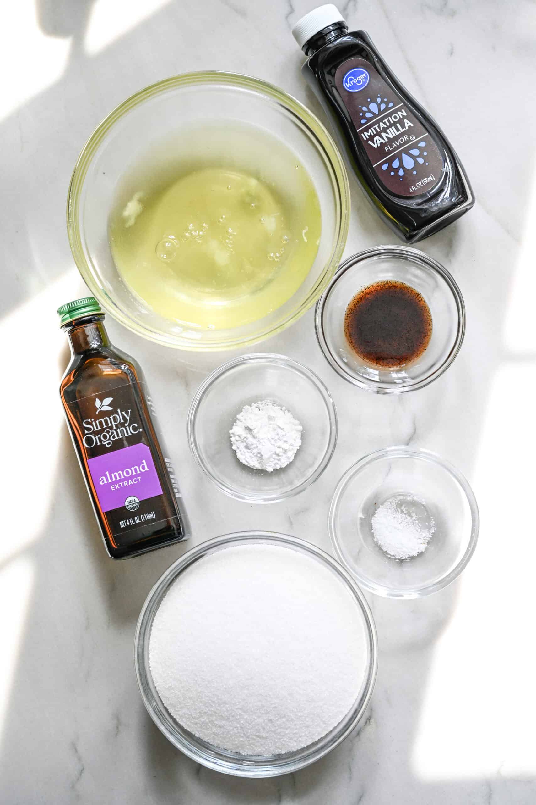 overhead view of ingredients for homemade marshmallow fluff in separate glass bowls.