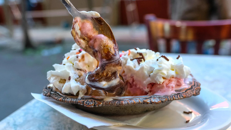 A spoon dipping into an ice cream sundae at Jahn's