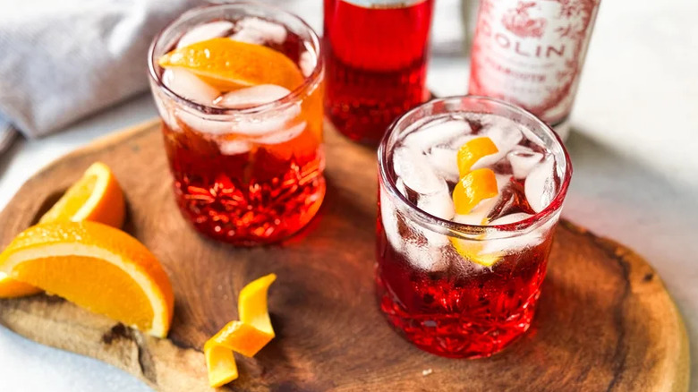 Two glasses of Americano cocktail with orange peel garnish
