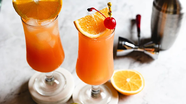 Hurricane cocktails with fresh orange garnish