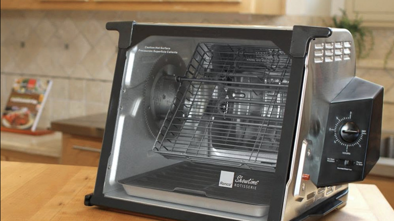 A Ronco rotisserie oven on a kitchen counter.
