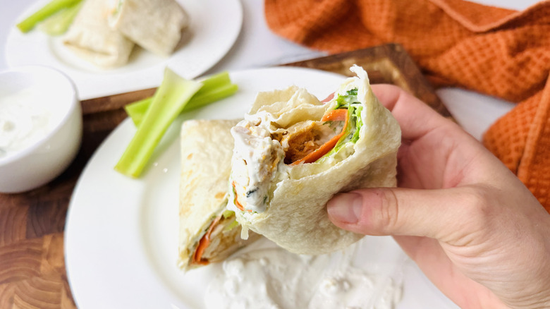 Bite taken out of Buffalo chicken wrap