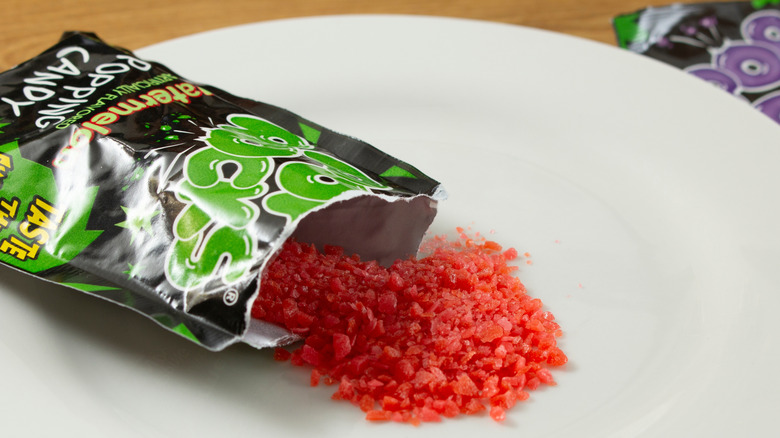 watermelon pop rocks spilling onto a plate