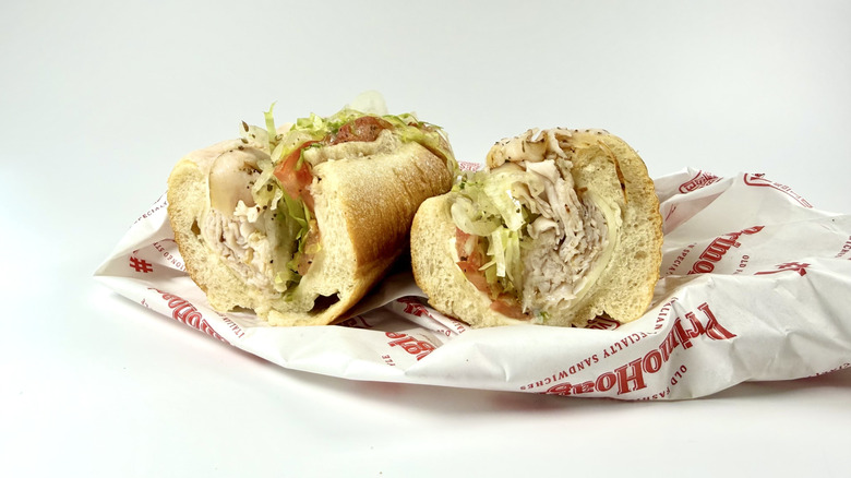 The Turkey and Cheese from Primo Hoagies with its wrapping on a white background