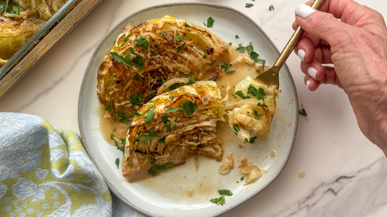 hand with forkful of cabbage