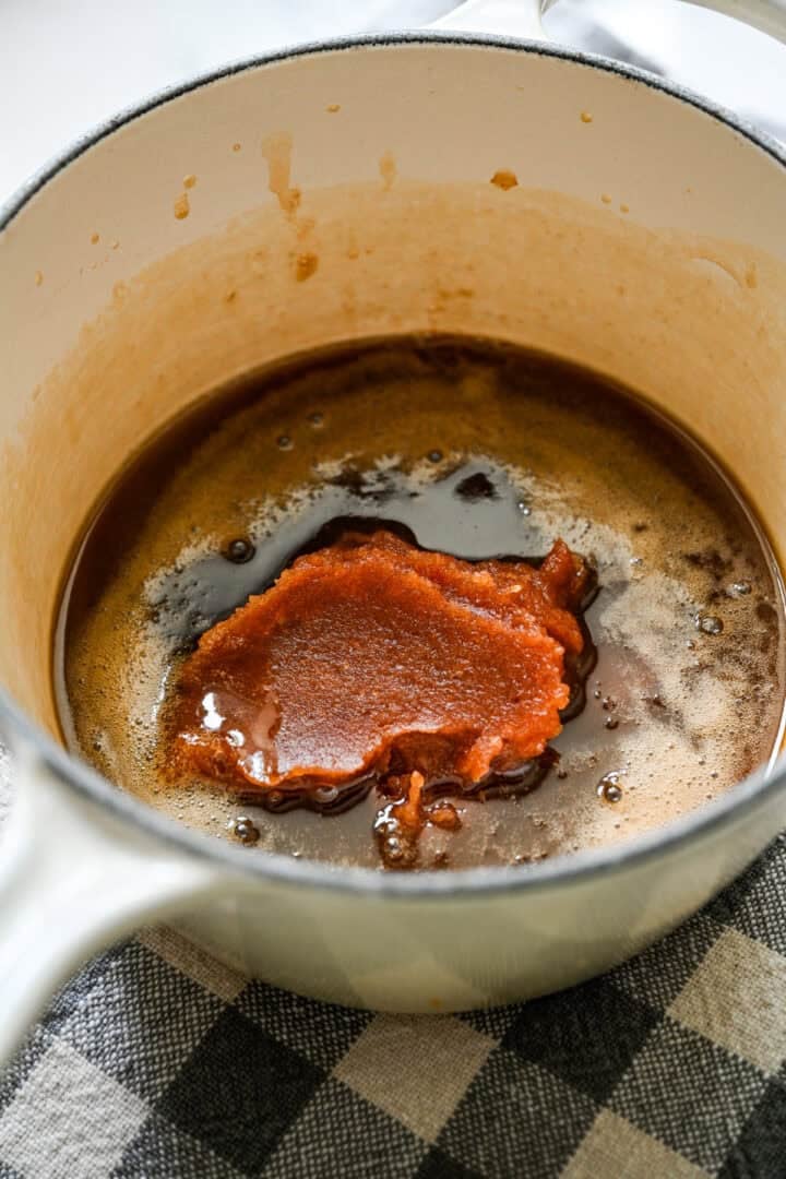 Date paste added to the butter and maple syrup mixture in the pot.