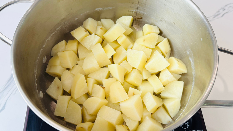 Diced potatoes in pot
