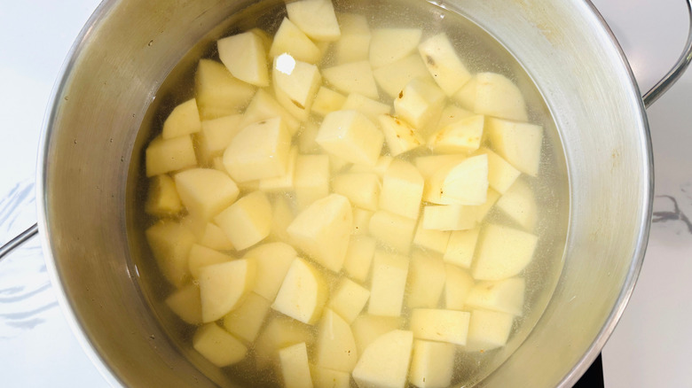 Diced potatoes in pot of water