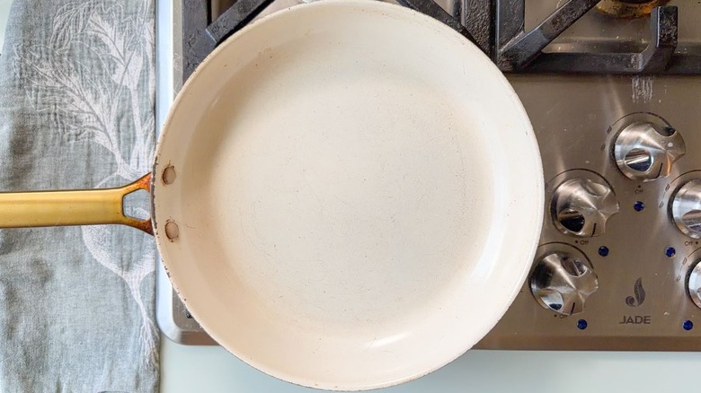 Large white skillet on stovetop