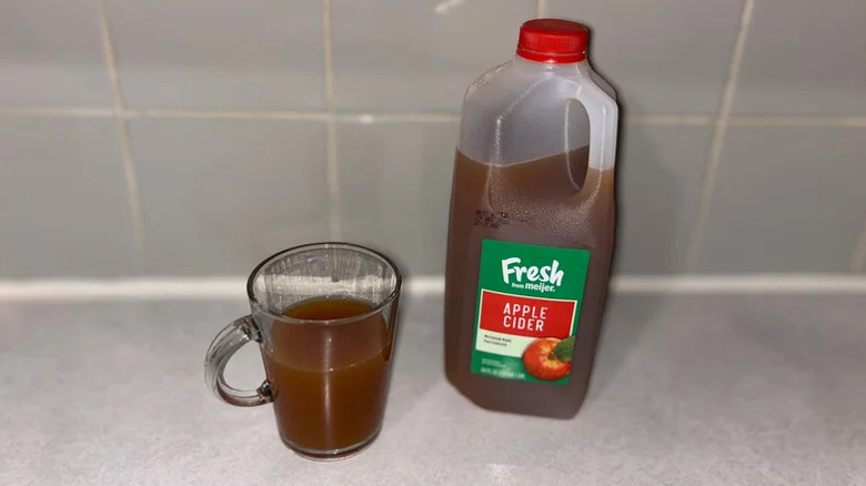 Fresh from Meijer Apple Cider on a table and in a glass