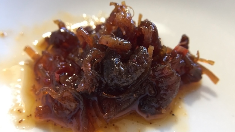 Close-up of XO sauce on a white plate.