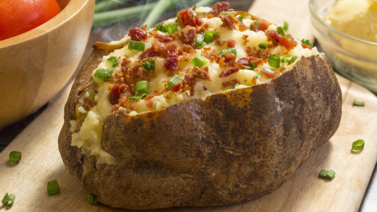How One Saucy Canned Staple Turns Baked Potatoes Into A 10-Minute Comfort Meal

