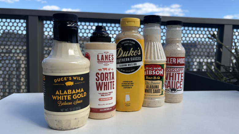 A lineup of five white BBQ sauces