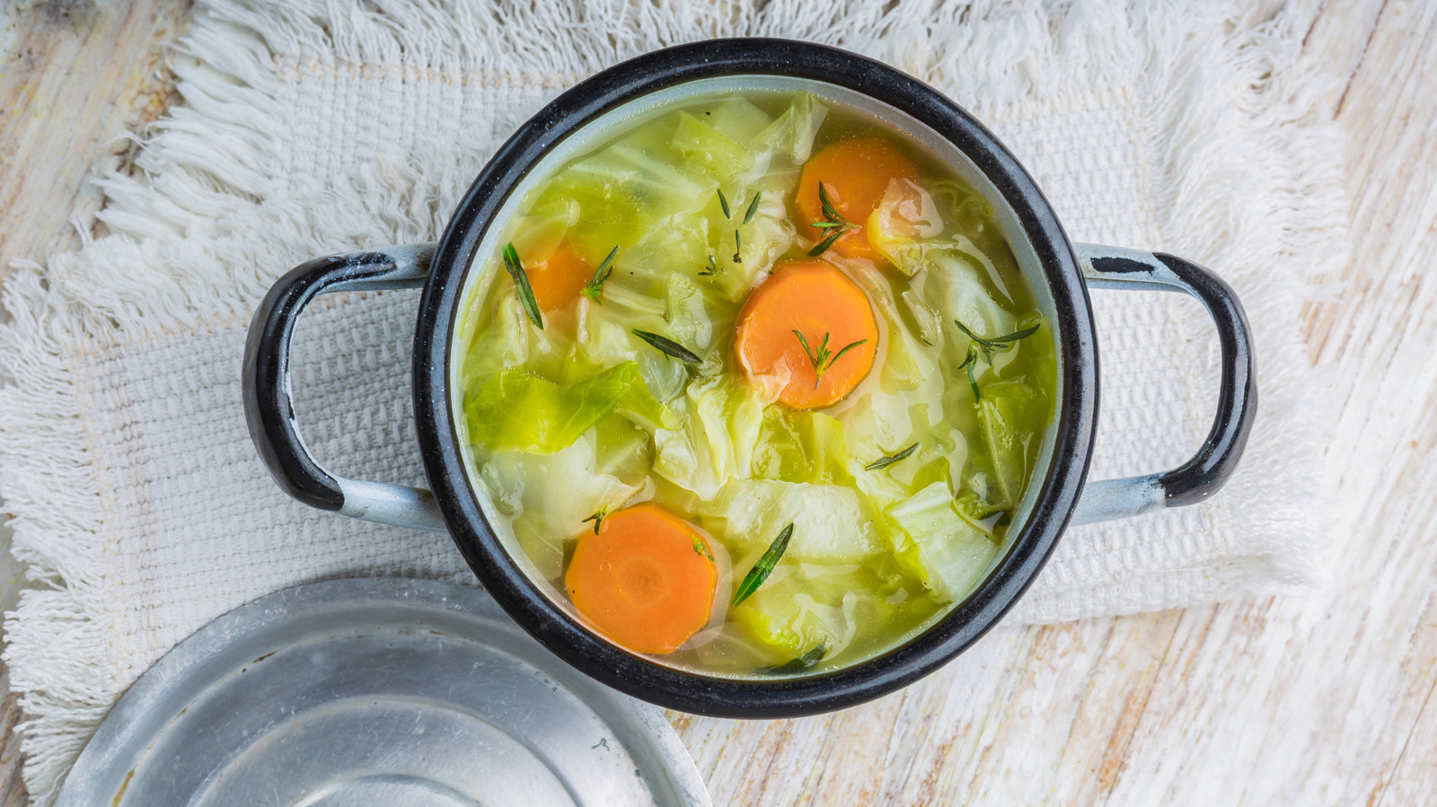 A Splash Of This Pantry Staple Takes Cabbage Soup To New Heights

