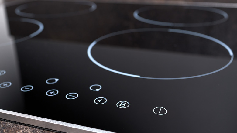 Modern electric induction stovetop with buttons