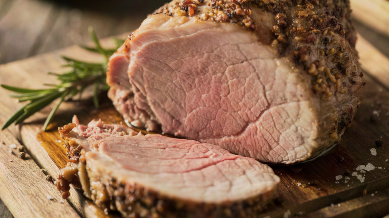 Pork tenderloin on a wooden table