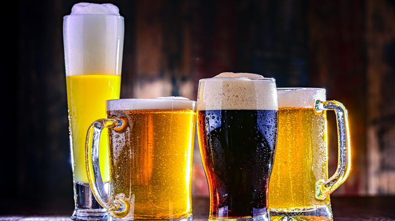 Four glasses of different types of beer.