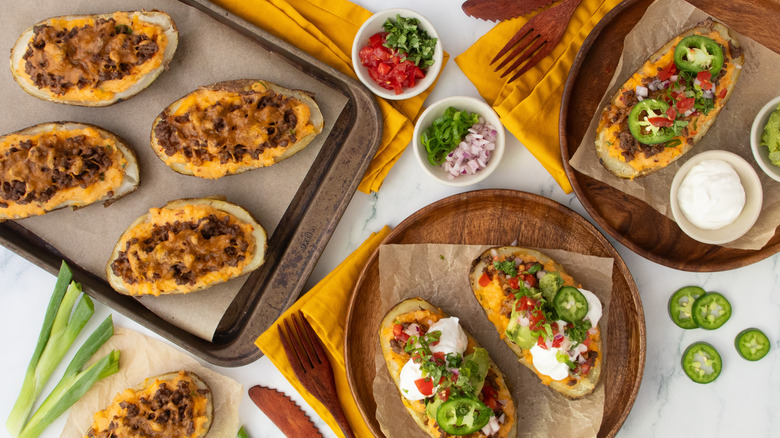 Overhead shot of several taco-themed twice baked potatoes
