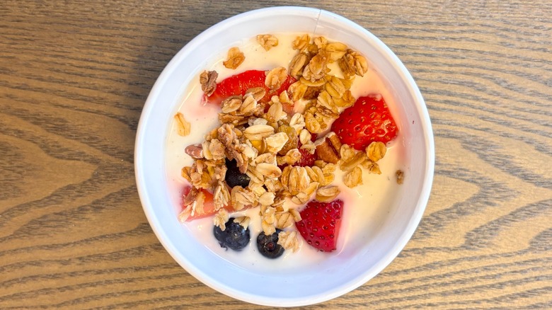 A bowl of Chick-fil-A Vanilla Yogurt with blueberries, strawberries, and granola
